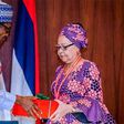 President Muhammdu Buhari receiving the report of the Tripartite Committee on the Review of National Minimum Wage from the Committee Chairman, Mrs Amal Pepple, at the State House on November 6, 2018.
