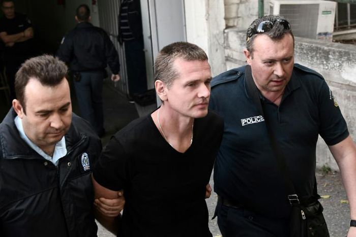 Russian Alexander Vinnik, centre, has been held in custody since his arrest last year on suspicion of money laundering