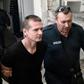 Russian Alexander Vinnik, centre, has been held in custody since his arrest last year on suspicion of money laundering
