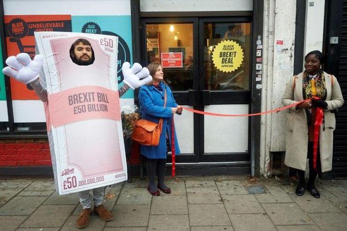 Activists perform a mock opening of a post-Brexit inspired pop-up shop in south London offering products 'which represent the miserable Brexit on offer'