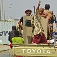 Yemeni pro-government forces drive through the eastern outskirts of Hodeida as they battle to seize the key Red Sea port city from Huthi rebels on November 10, 2018