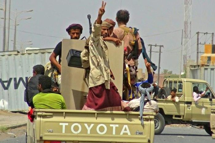 Yemeni pro-government forces drive through the eastern outskirts of Hodeida as they battle to seize the key Red Sea port city from Huthi rebels on November 10, 2018