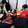 A Syrian woman receives treatment at a hospital after an assault on Aleppo, which Russia claimed was a chemical attack by rebels