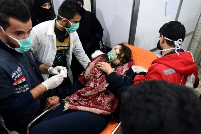 A Syrian woman receives treatment at a hospital after an assault on Aleppo, which Russia claimed was a chemical attack by rebels