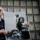Cuban veteran Alejandro Ferras Pellicer poses with a picture of late leader Fidel Castro at his personal revolution museum in Havana