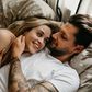 ___9125339___2018___11___21___8___high-angle-view-of-loving-young-couple-lying-on-bed-royalty-free-image-1032305820-1542739698