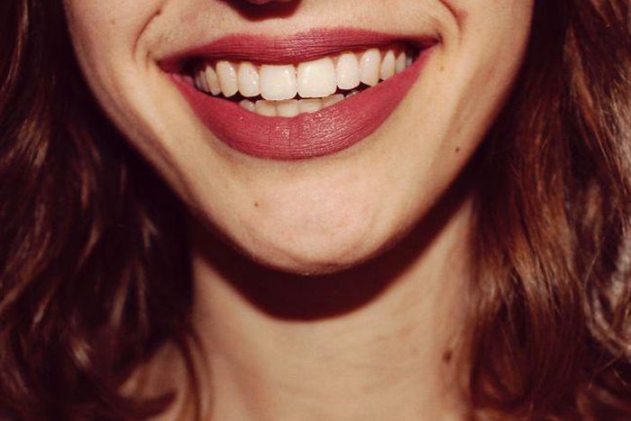 ___8920893___2018___9___30___23___midsection-of-smiling-woman-royalty-free-image-732737913-1537559741