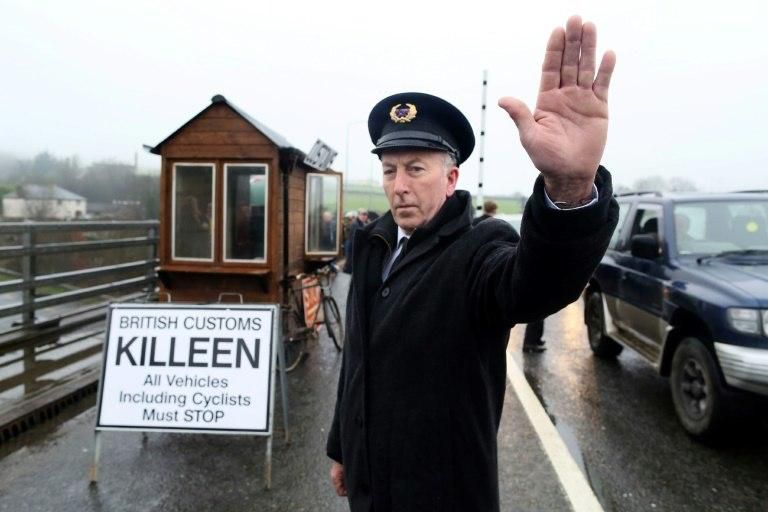 Demonstrators dressed as custom officials set up a mock customs checkpoint at the border crossing in Killeen, Northern Ireland near Dundalk to protest against the potential introduction of border checks post-Brexit