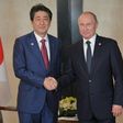Russian President Vladimir Putin (R) met with Japan's Prime Minister Shinzo Abe in Singapore on November 14, although their nations are technically at war