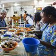 Anthony Bourdain and Nigerian food bloggers eating Pounded Yam and Egusi
