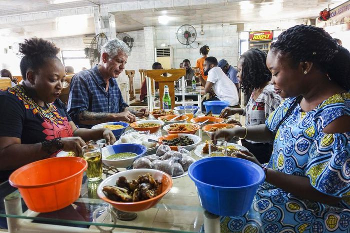 Anthony Bourdain and Nigerian food bloggers eating Pounded Yam and Egusi