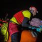 A member of Proactiva Open Arms organisation holds a new born baby rescued with her mother