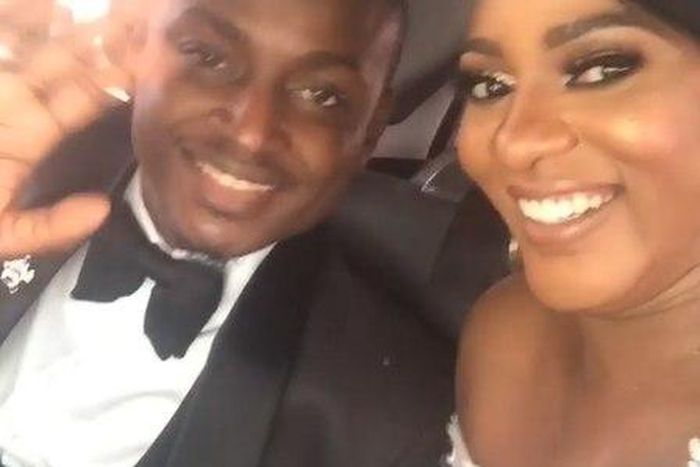 The newly-weds are a spontaneous couple in a private moment observed in a vehicle.