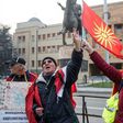 Demonstrators wave an old Macedonian flag during a protest against a process of renaming the country name in front of the Parliament building in Skopje on December 1, 2018, during the Parliament session