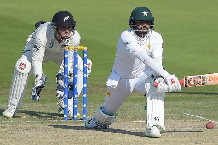 Pakistani batsman Azhar Ali (R) plays a shot against New Zealand December 5, 2018