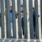 Would-be migrants to the United states from Honduras peer through the fence demarcating the US-Mexico border in San Ysidro, California