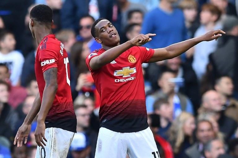 Manchester United forward Anthony Martial (right) celebrates his second goal against Chelsea