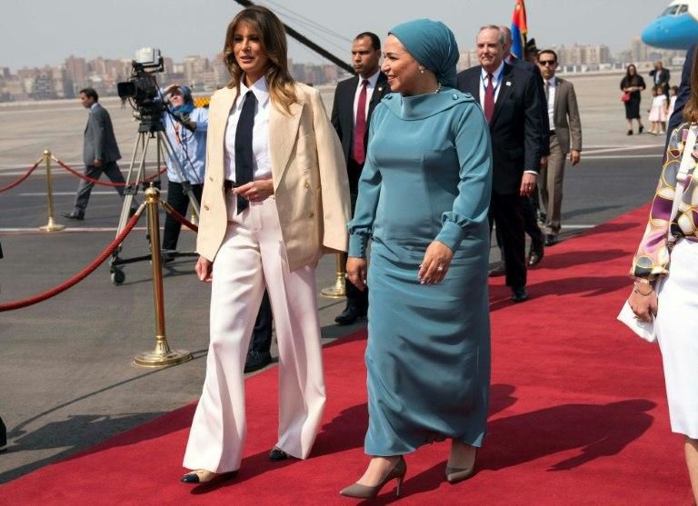 US First Lady Melania Trump walks with her Egyptian counterpart Intissar Amer al-Sisi after arriving at Cairo International Airport