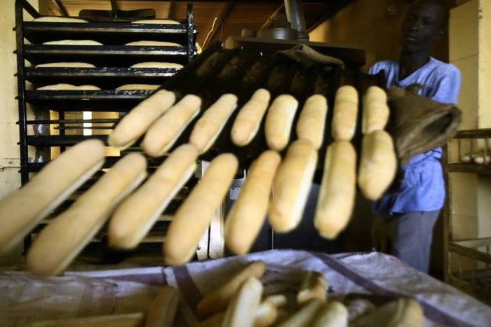 A Sudanese man works at a bakery in the capital Khartoum on January 5, 2018