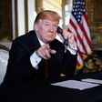 US President Donald Trump speaks to members of the military via teleconference from his Mar-a-Lago resort in Palm Beach, Florida, on Thanksgiving Day, November 22, 2018