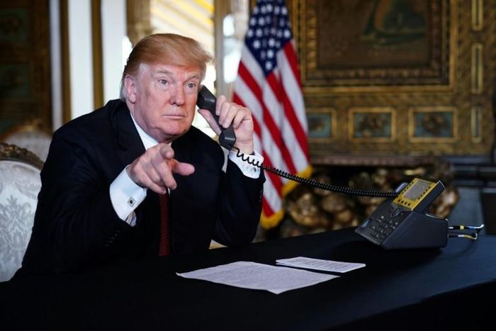 US President Donald Trump speaks to members of the military via teleconference from his Mar-a-Lago resort in Palm Beach, Florida, on Thanksgiving Day, November 22, 2018