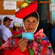 A voter in Ollantaytambo, near the ancient imperial Inca capital of Cuzco, shows her identity card as Peruvians voted on constitutional reforms aimed at curtailing corruption
