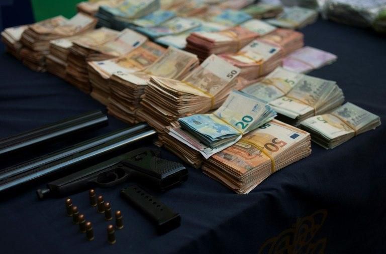 The raid also netted more than 300,000 euros in cash, four guns and luxury vehicles