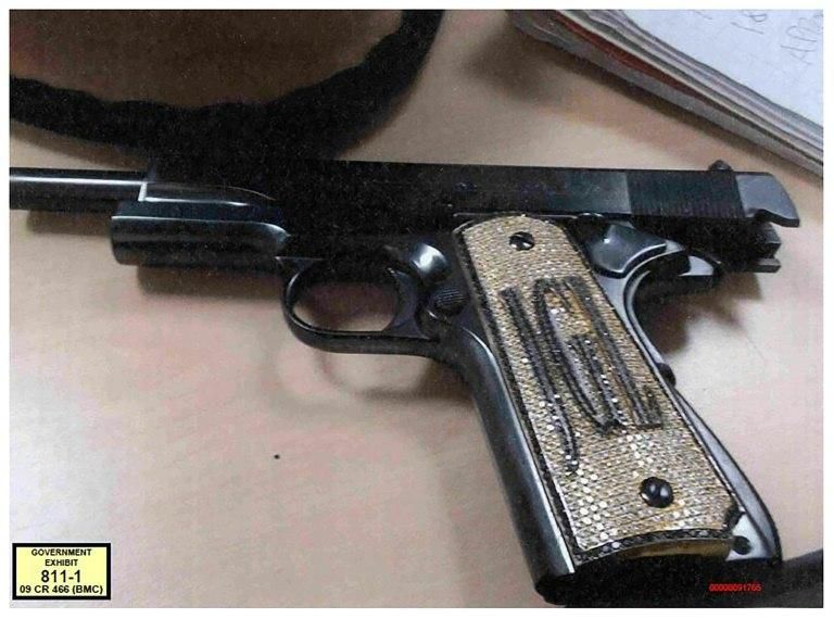A pistol owned by Joaquin "El Chapo" Guzman, emblazoned with his initials and encrusted with diamonds on the grip