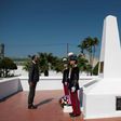 Prime Minister Edouard Philippe (L) lays a wreath at the French memorial in Dien Bien Phu, the battle that spelled the end of France's colonial rule in Indochina
