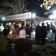 Relatives of blast victims gather outside a hospital of Italian NGO Emergency in Kabul following a suicide attack at a meeting of top clerics in the Afghan capital