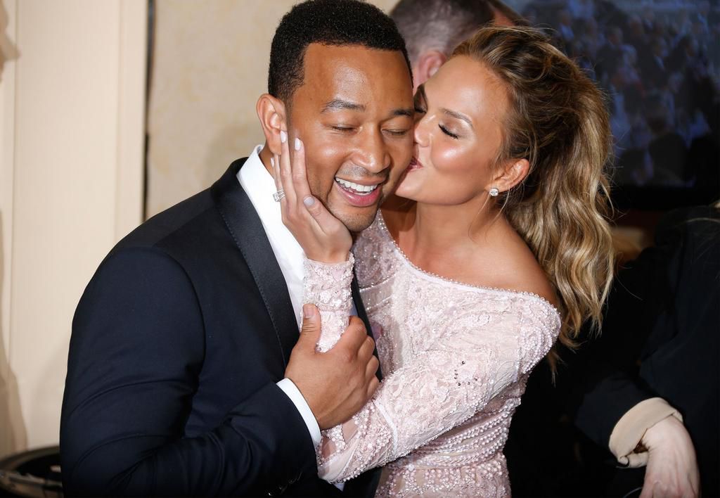 Chrissy Teigen and John Legend are a poster couple for PDA [Credit Getty]