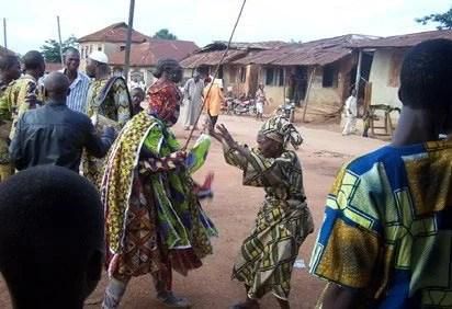 Masquerade flogging residents [Legit.ng]