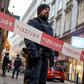 Austrian policemen stand guard at the site of a shooting outside Figlmueller passage in the city center of Vienna on December 21, 2018