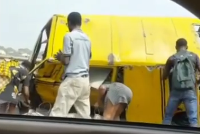 From the interior of a car, the victims of an accident on the 3rd Mainland Bridge are observed as they picked their belongings.