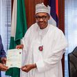 Buhari, being presented with an attestation certificate by the registrar of WAEC, Dr. Uyi Uwadiae on Friday, November 2, 2018, at the State House