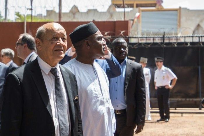 French Foreign Affairs Minister Jean-Yves Le Drian, left, with Burkina Faso's Foreign Affairs Minister Alpha Barry at the inauguration of an education and start-up incubator in Ouagadougou on October 19, 2018