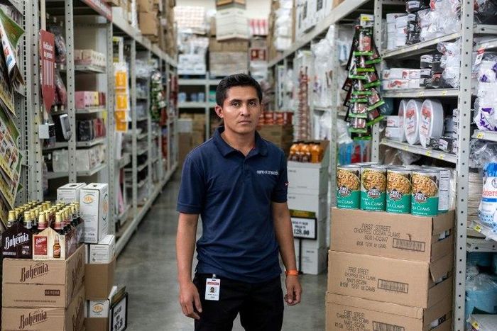 Denny Guevara, 26, has found work at a supermarket in Mexico; his next dream is to make enough money to send for the wife and three children he left behind in Honduras