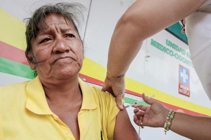 A Venezuelan woman is vaccinated against measles at the country's border with Colombia -- regional health authorities say vaccination is key to stemming outbreaks in several countries