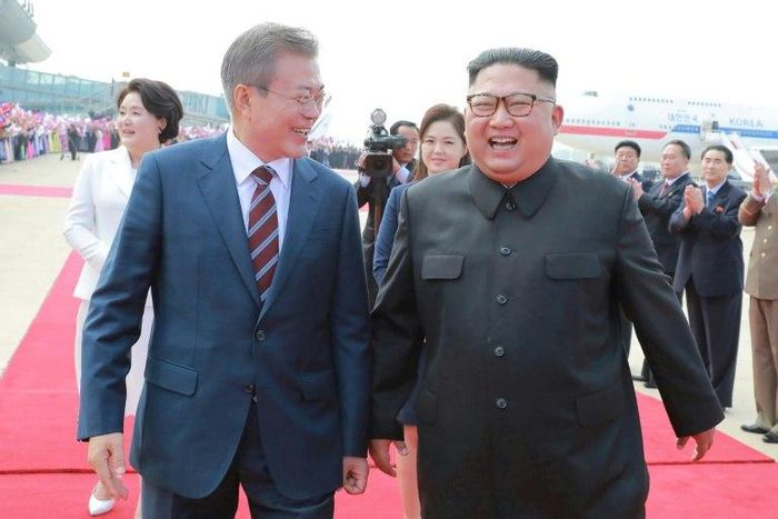 North Korean leader Kim Jong Un (R) will visit Seoul 'soon', according to the South's President Moon Jae-in (L)