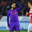 Head-scratcher: Mohamed Salah (left) failed to fire as Liverpool suffered a shock 2-0 defeat to Red Star Belgrade