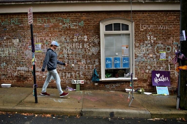 A memorial is scrawled on a wall at the site where 32-year-old Heather Heyer was killed by avowed neo-Nazi James Fields in August 2017 in Charlottesville, Virginia