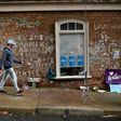 A man walks past a memorial to 32-year-old Heather Heyer, as James Fields -- an avowed neo-Nazi -- goes on trial over her death in Charlottesville in August 2017