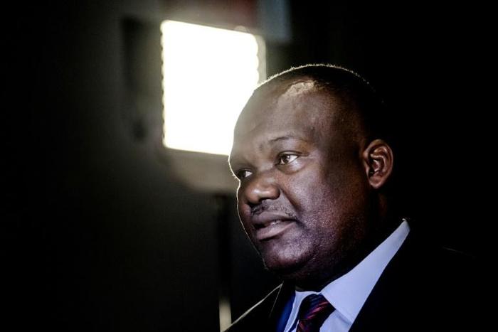 In the spotlight: DRC election commission chief Corneille Nangaa, pictured at the National Assembly on Thursday, where he briefed politicians about the chances of holding Sunday's elections
