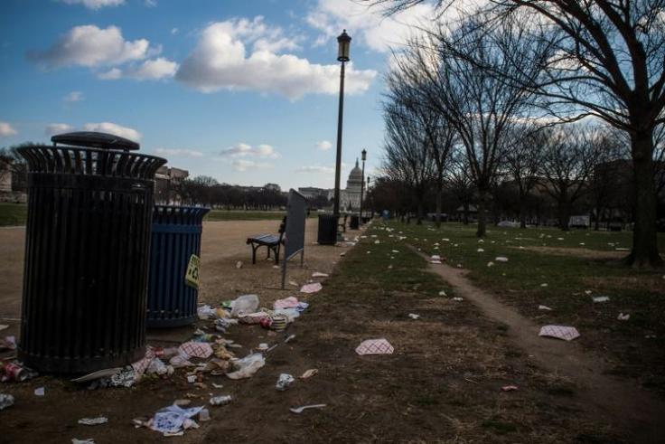 Litter spills out of a public dustbin on the National Mall in Washington as the US government shutdown goes into its third day