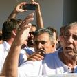 Brazilian "spiritual healer" Joao Teixeira de Faria (C), known as "Joao de Deus" (John of God) is escorted by supporters upon arrival at his "healing center" southwest of Brasilia