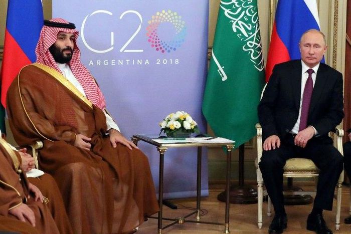 Russia's President Vladimir Putin (R) said he and Crown Prince Mohammed bin Salman 'have agreed to extend our agreement' to limit oil output