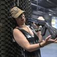 Brazilian lawyer Barbara Barroso proudly shows off her brand-new 12-gauge Armsan pump-action shotgun at the Colt 45 Shooting Club in Rio de Janeiro