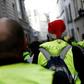 A yellow vest protestor with a Christmas hat walks in the Montmartre area in Paris, one of several demonstrations across France, albeit numbers were down on previous rallies