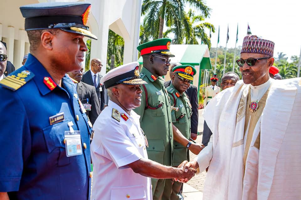 President Muhammadu Buhari and security officials during his 76th birthday