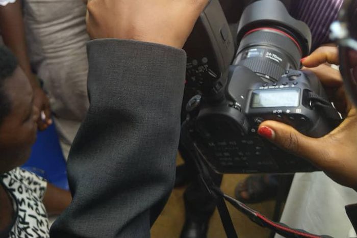 Vice President Yemi Osinbajo cradles new born given birth to in IDP camp